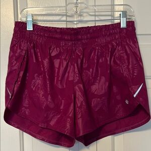 Athleta dark pink floral embossed Racer Run shorts